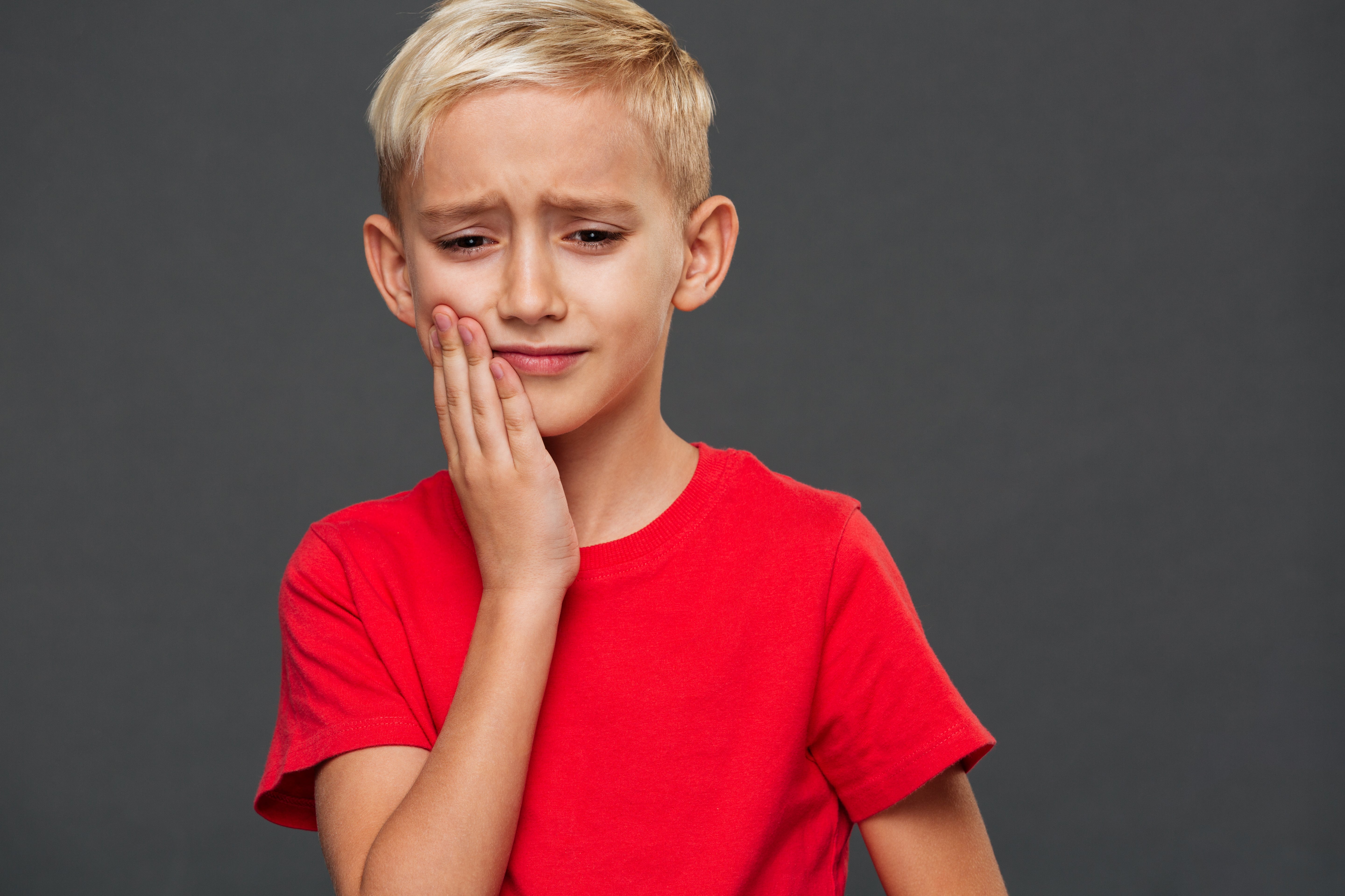 sad-little-boy-child-with-toothache-min